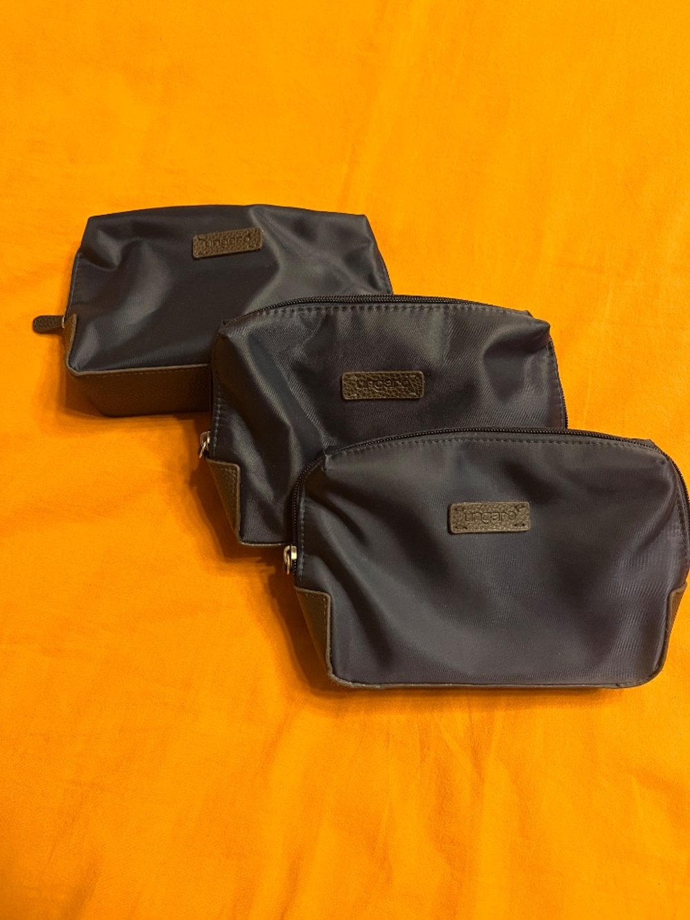 Emanuel Ungaro Travel/Cosmetic bag SET OF 3, deep navy blue & brown leather